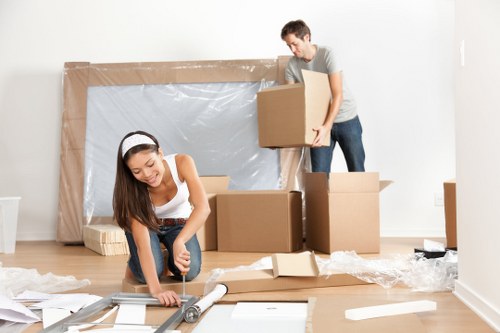 Moving home support in Westminster with packed boxes and a removal van