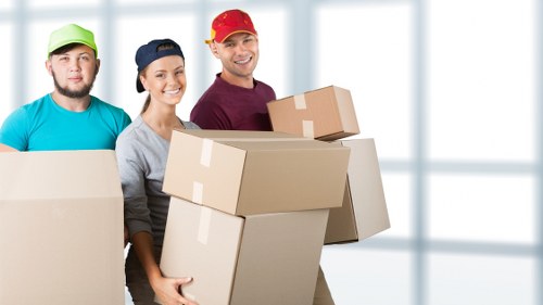 Packed moving boxes and furniture ready for a Westminster property move