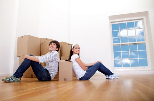 Professional moving team handling boxes and furniture in Westminster